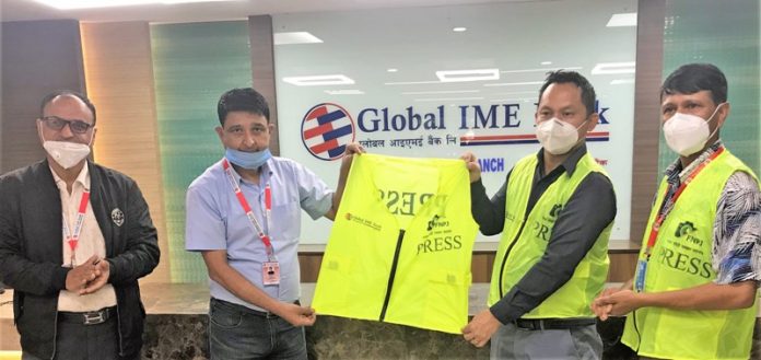 Global IME Bank Limited handover press jackets to photo journalists